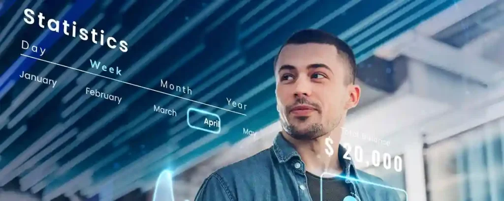 Man in front of a screen of automated financial statistics, highlighting the evolution of fintech with artificial intelligence.