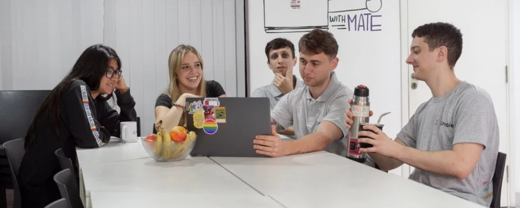 Crombie employees developing software under the outsourcing model.