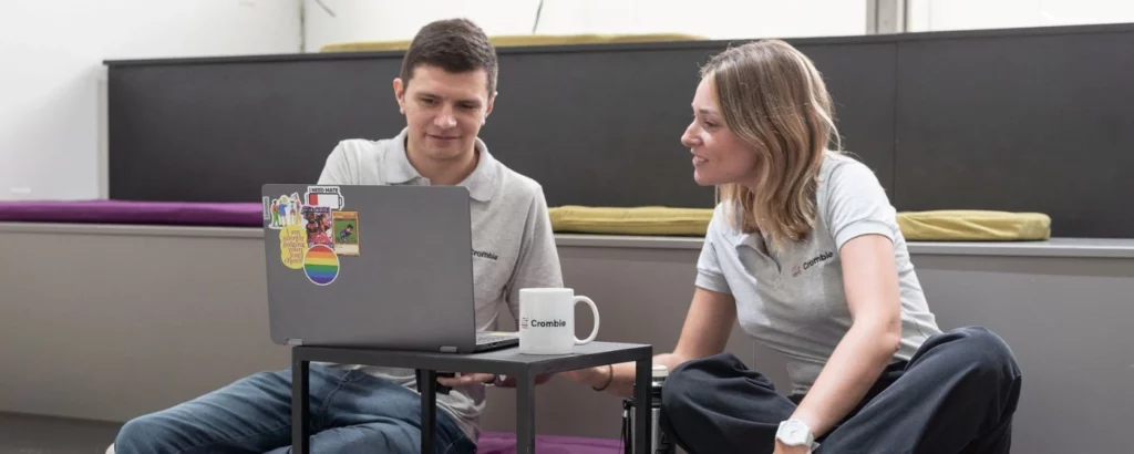 Two Crombie developers working at a computer