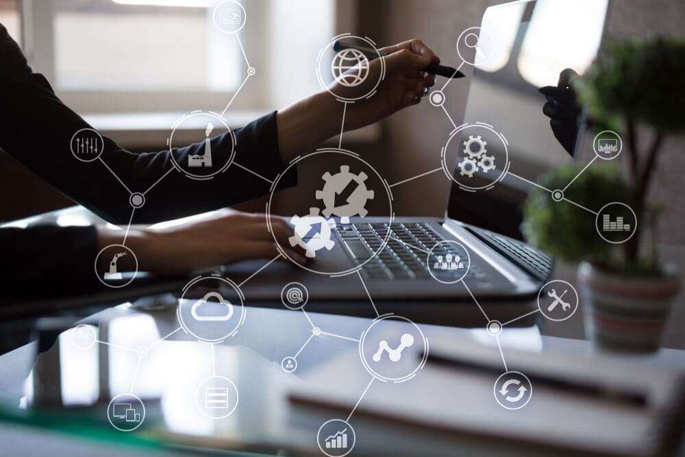 Business professionals working with interconnected systems, cloud platforms, analytics, and automation tools representing system integration and data normalization.